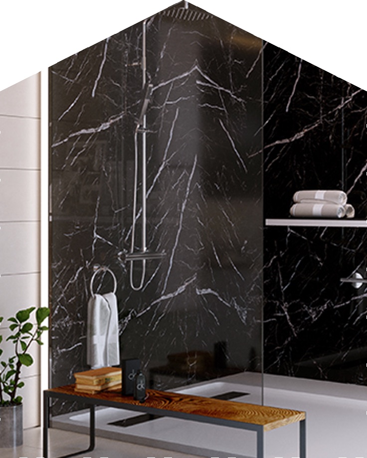 Black marble shower wall with white veining, a glass panel and a rain shower
